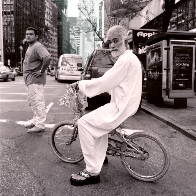 Man on bike - “New York, Walking Down the Street” by PhotoFactum - be artist be art magazine